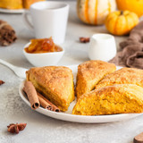 Breakfast-with-spicy-pumpkin-scones-cup-tea-milk_132278-1434